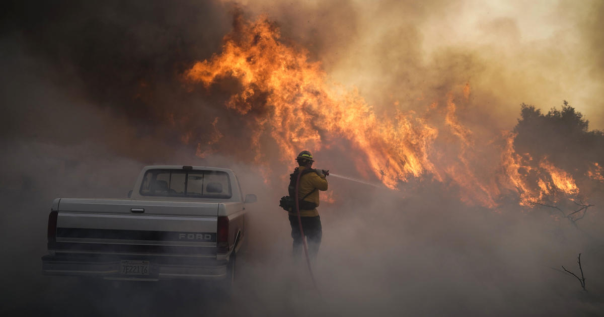 Southern California wildfires explode, forcing more than 60,000 to evacuate