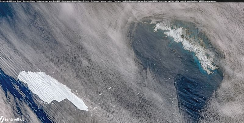 Massive iceberg pivots, breaks near south Atlantic penguin colony island