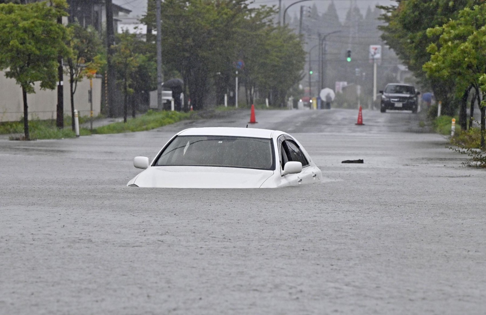 Rain pounds Japan's northeast; Akita residents flee overflowing river