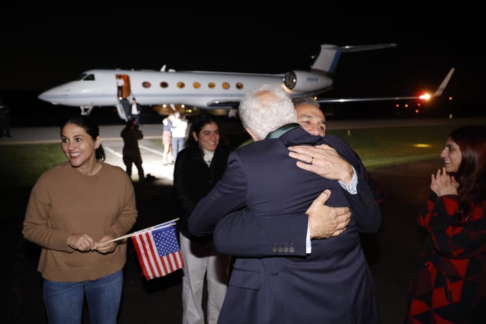 Americans released by Iran arrive home, tearfully embrace their loved ones and declare: 'Freedom!'