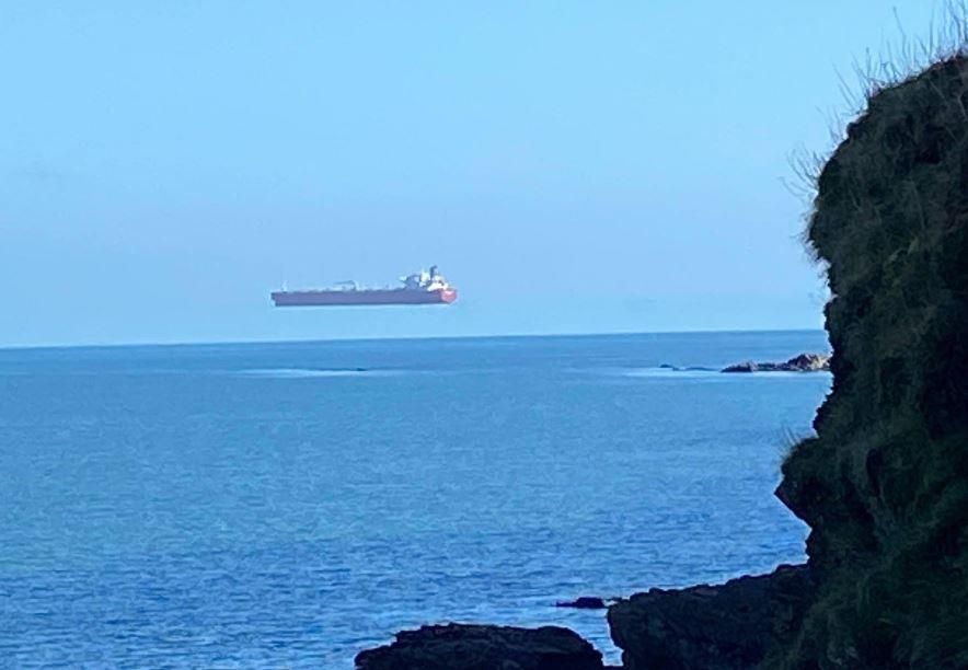 Photos appear to show a ship hovering over the water
