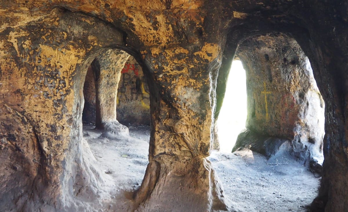 An exiled English king who became a hermit saint could have been the first resident of a 1,200-year-old cave house, archaeologists believe