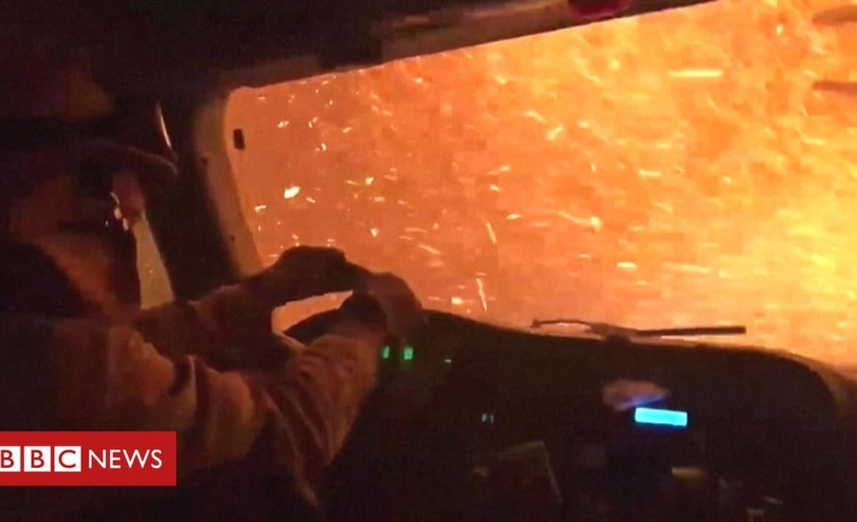 Inside a US fire truck driving through a wildfire