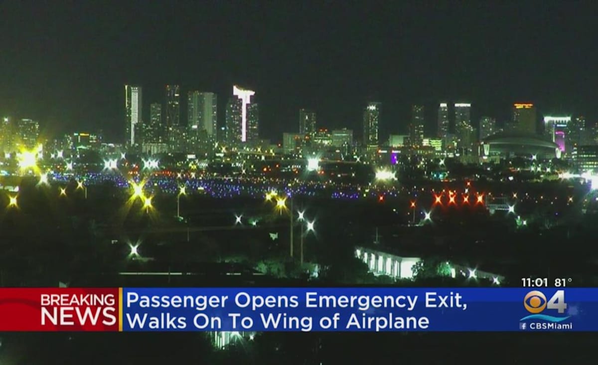 Man opens emergency door, jumps onto wing of plane in Miami