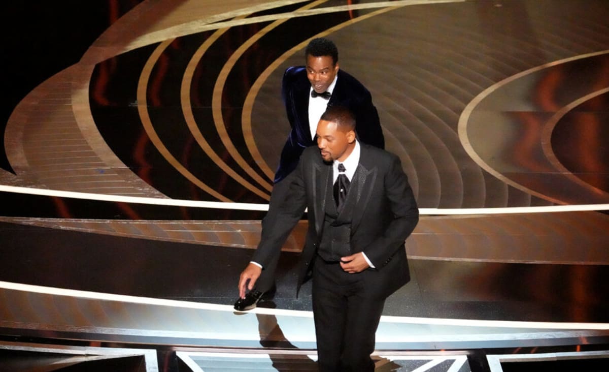 Will Smith hits Chris Rock after joke about his wife, Jada.