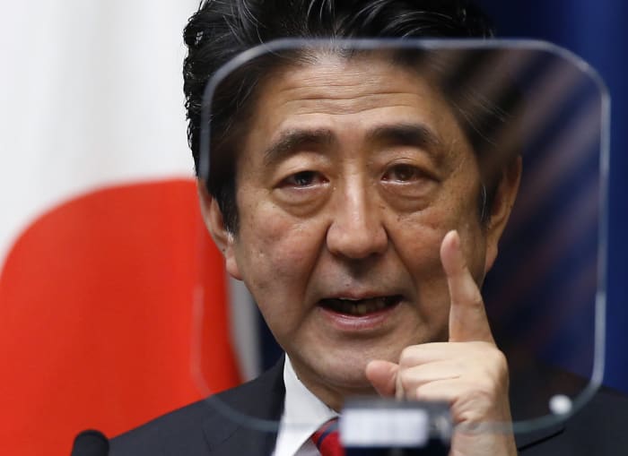Shinzo Abe, powerful former Japan PM, leaves divided legacy