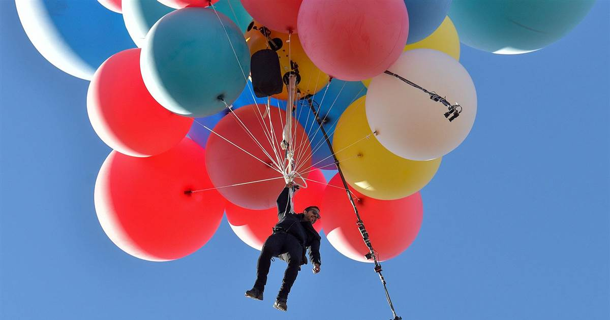 Watch: David Blaine hangs from balloons high above Arizona desert