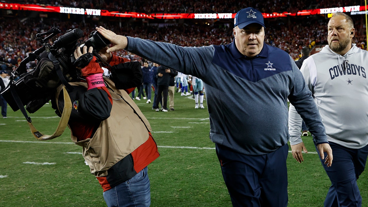 Cowboys' Mike McCarthy stiff arms cameraman after loss to 49ers